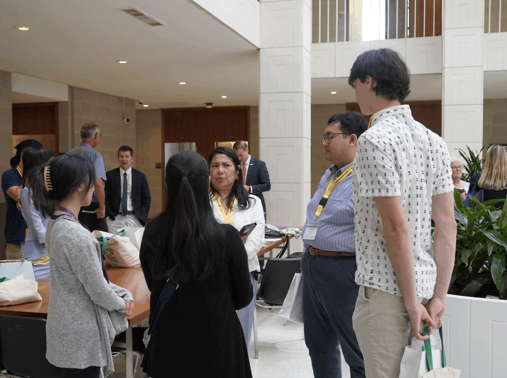 Photo of advocates speaking to each other at the N.C. Legislative Building